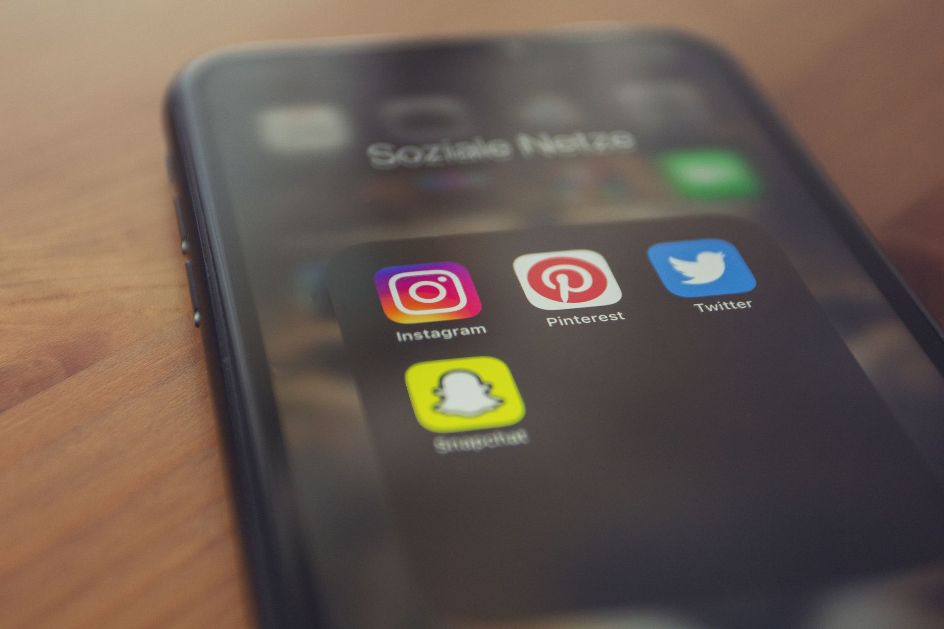 Smartphone displaying popular social media apps